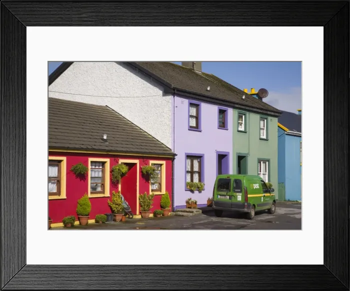 Framed Print : Green post van outside colourful houses in main street Framed Print : Green post van outside colourful houses in main street