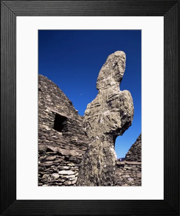 Framed Print : Early Christian cross and stone huts Framed Print : Early Christian cross and stone huts