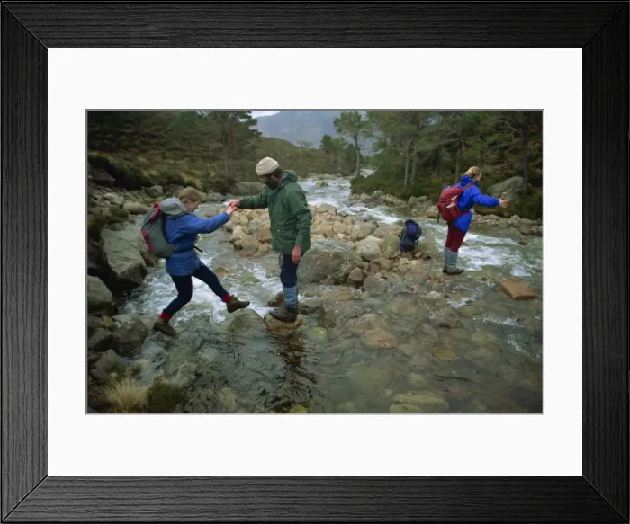 Framed Print : Hikers crossing river in the Ben-Damph Hills Framed Print : Hikers crossing river in the Ben-Damph Hills