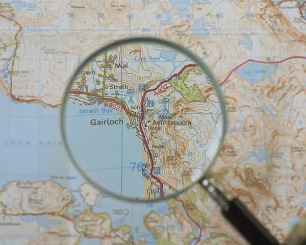 Magnifying glass above an Ordnance Survey map