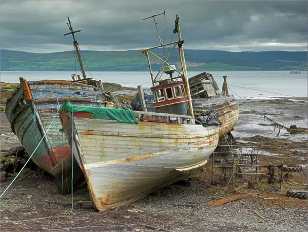 Wrecked fishing boats in gathering storm