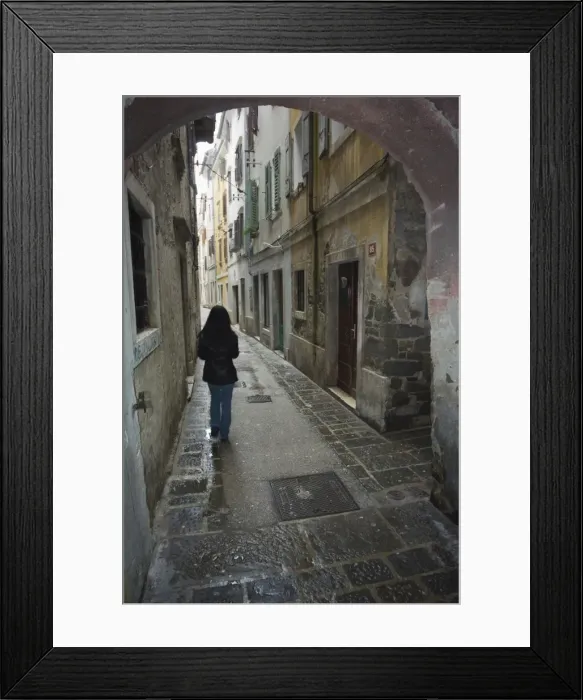 Framed Print : Girl walking through old street Framed Print : Girl walking through old street