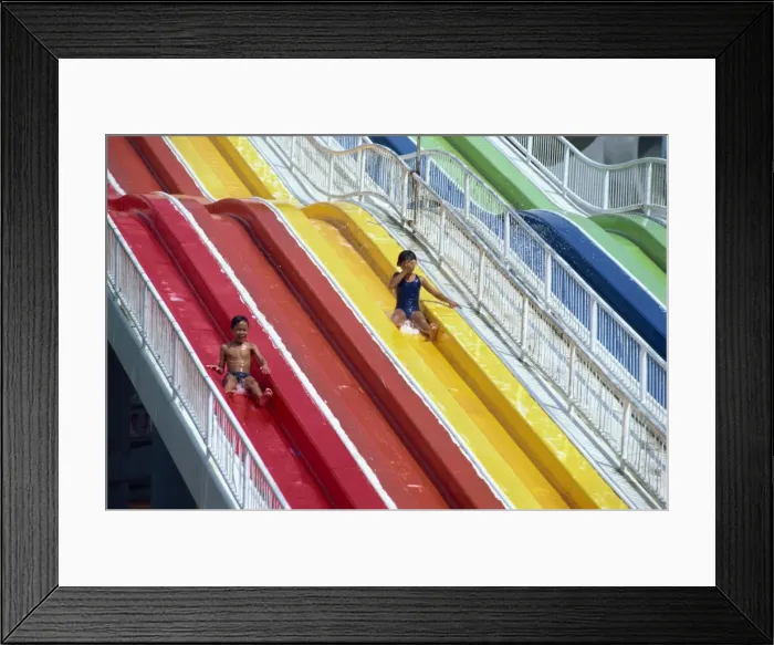 Framed Print : Children on the water chute of the Big Splash Aquatic Disneyland Framed Print : Children on the water chute of the Big Splash Aquatic Disneyland