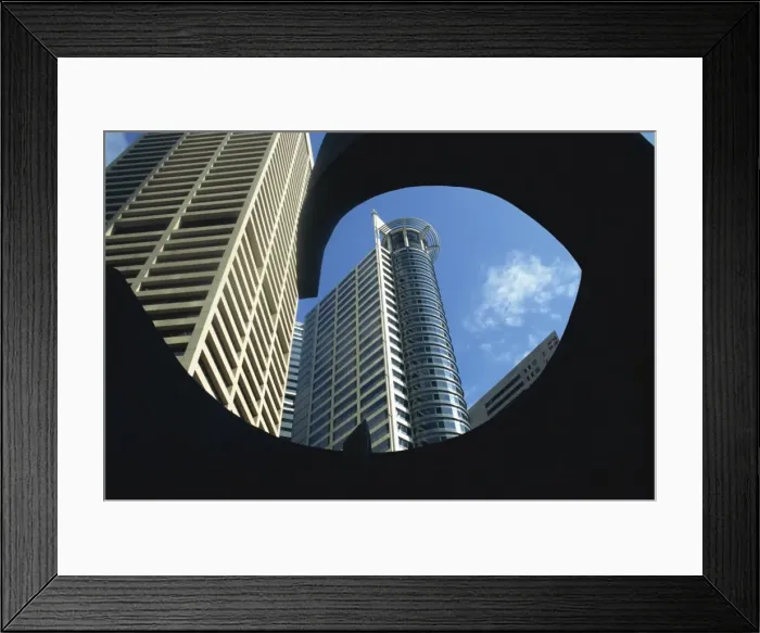 Framed Print : Skyscrapers of the Raffles Business Centre from a low Framed Print : Skyscrapers of the Raffles Business Centre from a low