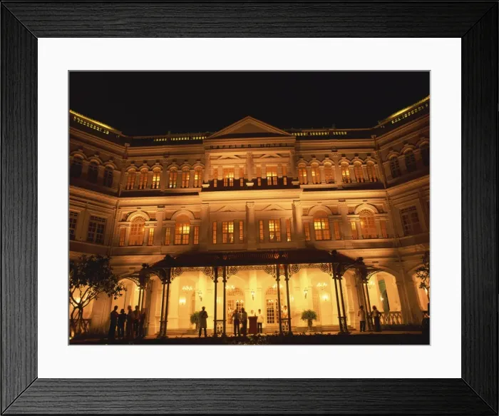Framed Print : The facade of the Raffles Hotel at night in Singapore Framed Print : The facade of the Raffles Hotel at night in Singapore