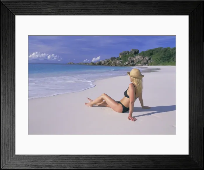 Framed Print : Woman sitting on the beach Framed Print : Woman sitting on the beach