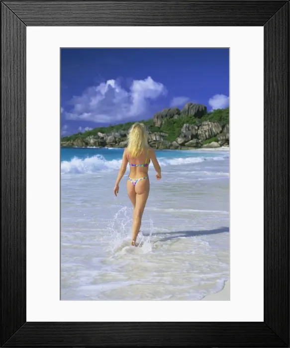 Framed Print : Woman walking on the beach Framed Print : Woman walking on the beach