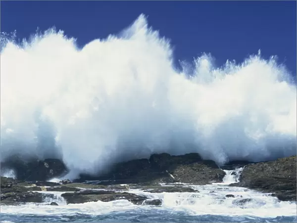 Waves crashing on rocks on the coast of South Africa