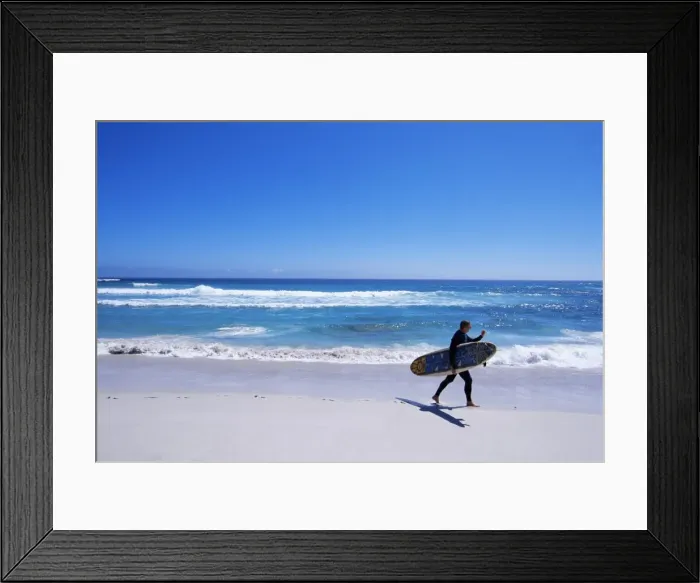 Framed Print : Surfer walking with his board on Kommetjie beach Framed Print : Surfer walking with his board on Kommetjie beach