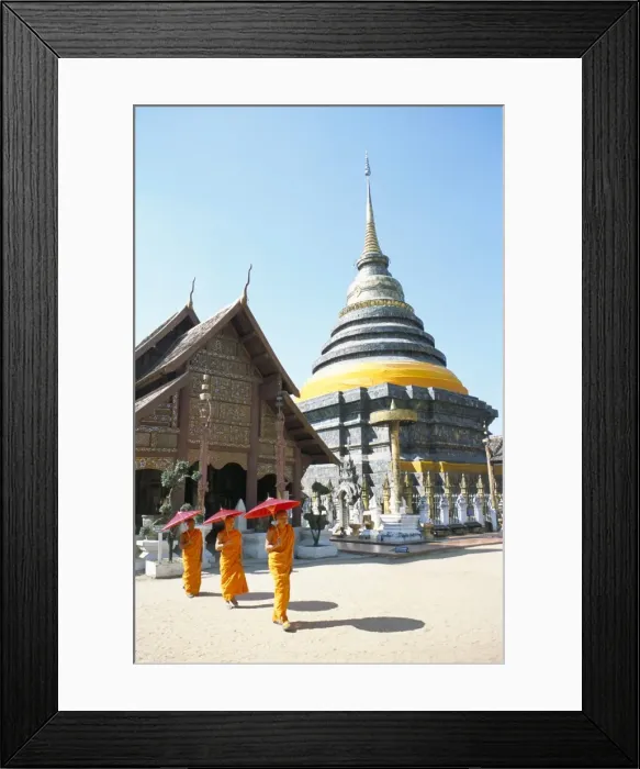 Framed Print : Novice monks and Wat Phra That Lampang Luang
