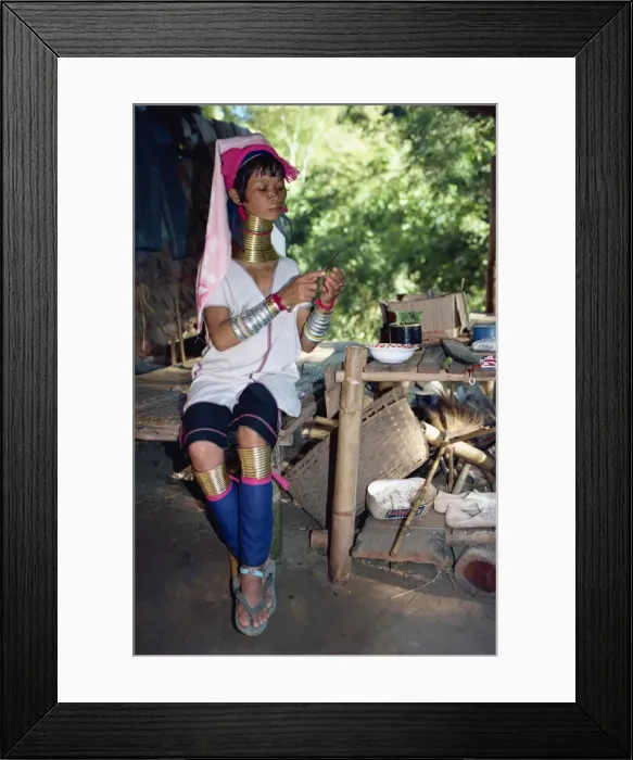 Framed Print : Long necked woman preparing food on the Thai-Burma border in Thailand Framed Print : Long necked woman preparing food on the Thai-Burma border in Thailand
