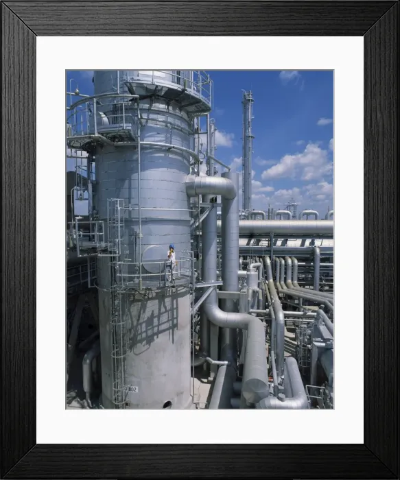 Framed Print : A worker wearing hard hat and using a mobile phone Framed Print : A worker wearing hard hat and using a mobile phone