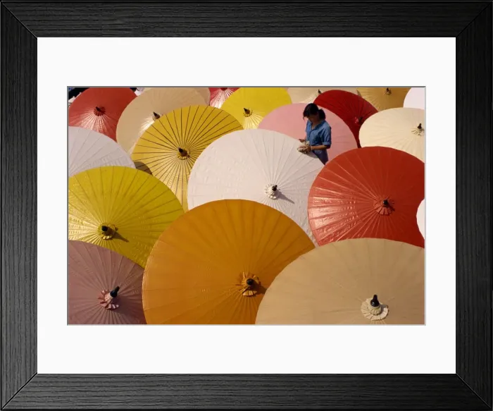 Framed Print : Woman finishing painted umbrellas in a village near Chiang Mai Framed Print : Woman finishing painted umbrellas in a village near Chiang Mai