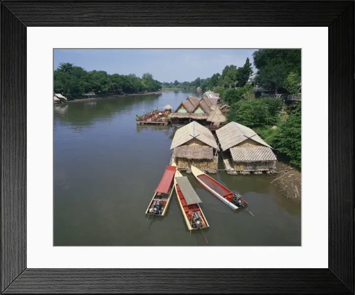 Framed Print : Boats moored near a restaurant on the Kwai River in Thailand Framed Print : Boats moored near a restaurant on the Kwai River in Thailand