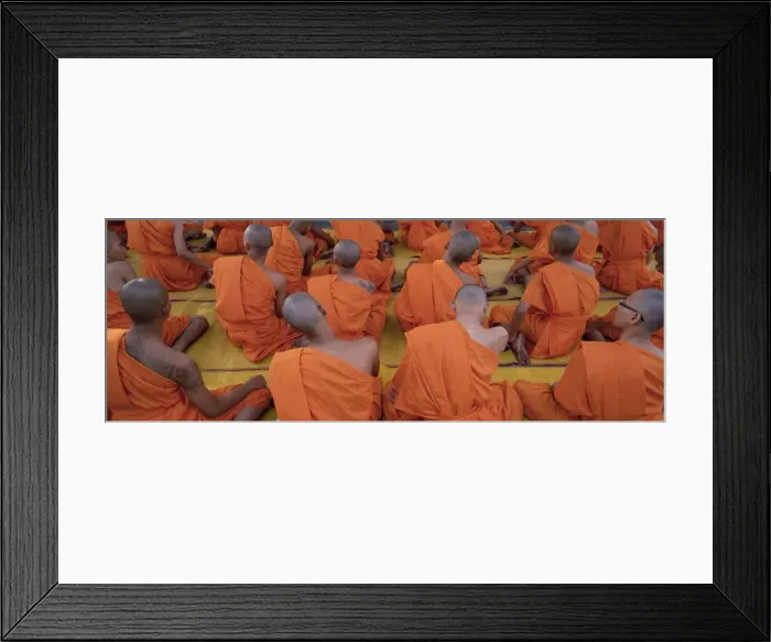 Framed Print : Back view of seated Buddhist monks at prayer meeting Framed Print : Back view of seated Buddhist monks at prayer meeting