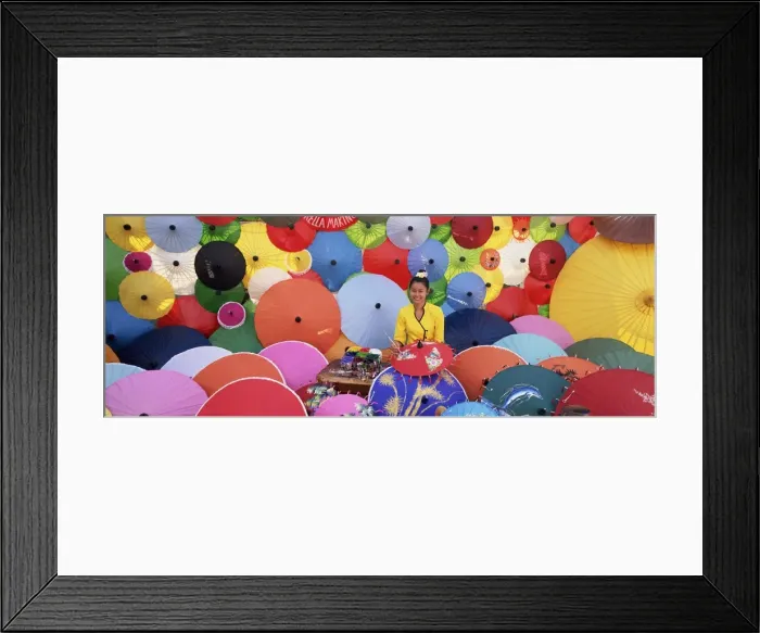 Framed Print : Woman painting umbrellas Framed Print : Woman painting umbrellas
