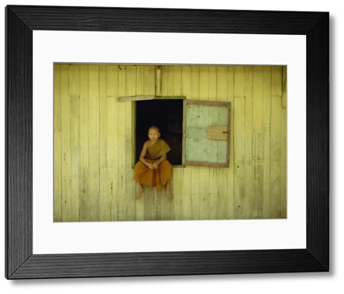 Framed Print : Portrait of a young monk at Wat Phawtpo in Chiang Mai Framed Print : Portrait of a young monk at Wat Phawtpo in Chiang Mai