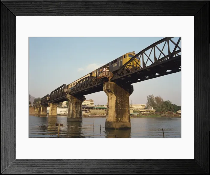 Framed Print : Train crossing the River Kwai Bridge at Kanchanburi in Thailand Framed Print : Train crossing the River Kwai Bridge at Kanchanburi in Thailand