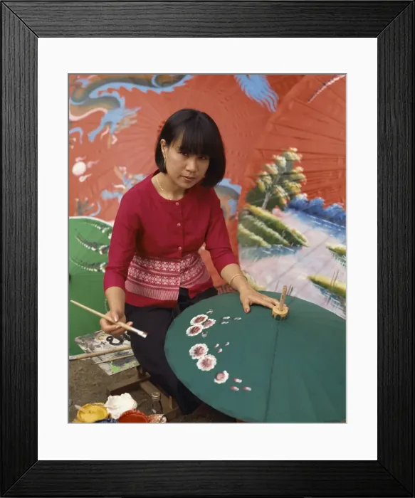 Framed Print : Portrait of a woman hand painting umbrellas in Chiang Mai Framed Print : Portrait of a woman hand painting umbrellas in Chiang Mai