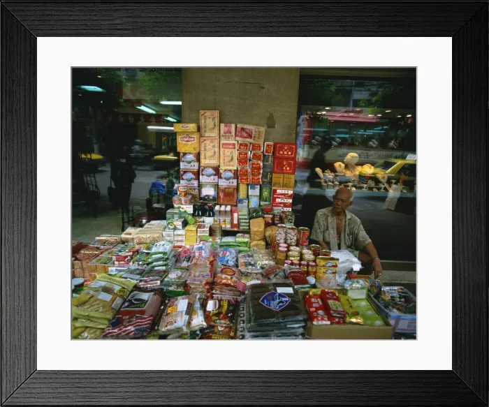 Framed Print : Elderly street trader with his stall in Bangkok Framed Print : Elderly street trader with his stall in Bangkok
