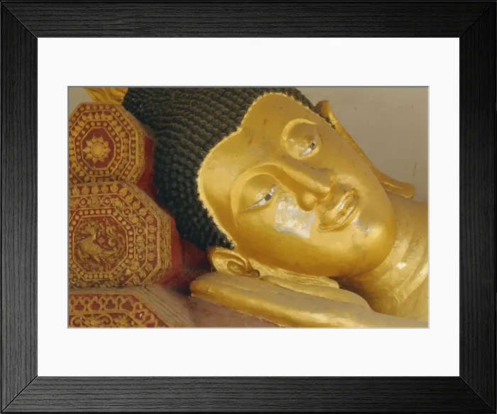 Framed Print : Close-up of head of a reclining Buddha statue Framed Print : Close-up of head of a reclining Buddha statue