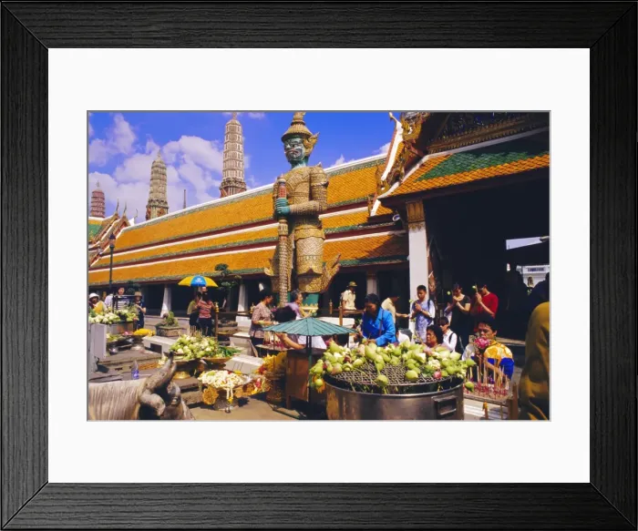 Framed Print : People worshipping and offering flowers in the Wat Phra Kaew complex Framed Print : People worshipping and offering flowers in the Wat Phra Kaew complex