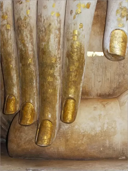 Detail of the hand of a stucco seated Buddha statue