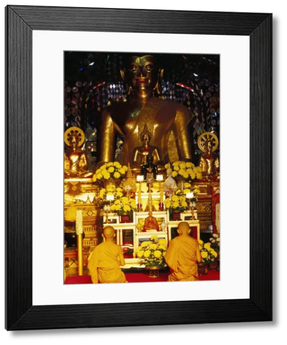 Framed Print : Buddhist monks worshipping inside temple Framed Print : Buddhist monks worshipping inside temple