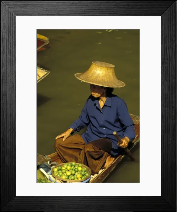 Framed Print : Portrait of a Thai woman vendor in straw hat with a basket of limes Framed Print : Portrait of a Thai woman vendor in straw hat with a basket of limes
