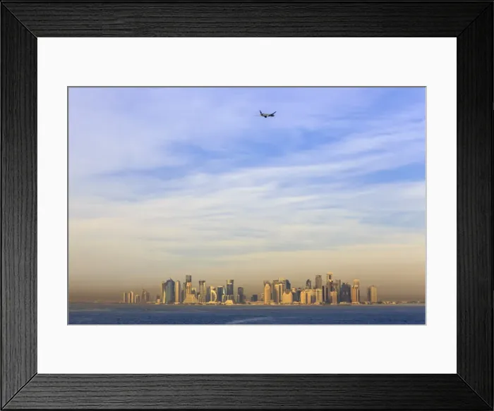 Framed Print : Jet airplane after take off from Hamad International Airport, seen above Doha city Framed Print : Jet airplane after take off from Hamad International Airport, seen above Doha city