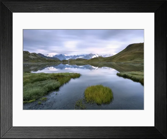 Framed Print : The mountain range is reflected in Fenetre Lakes at dusk, Ferret Valley, Saint Rhemy Framed Print : The mountain range is reflected in Fenetre Lakes at dusk, Ferret Valley, Saint Rhemy
