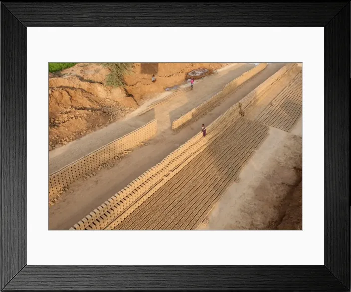 Framed Print : Hand made bricks laid out on the ground to dry before baking, northeast of Jaipur Framed Print : Hand made bricks laid out on the ground to dry before baking, northeast of Jaipur