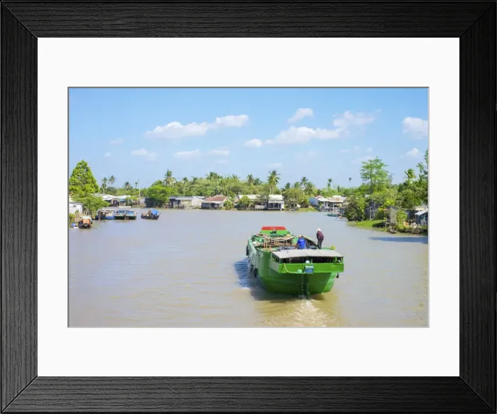 Framed Print : A boat on a branch of the Mekong River at Phong Dien, Can Tho, Mekong Delta, Vietnam