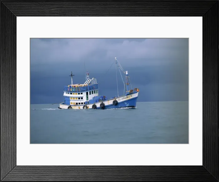 Framed Print : Fishing boat at sea under stormy skies off the coast near Krabi Framed Print : Fishing boat at sea under stormy skies off the coast near Krabi