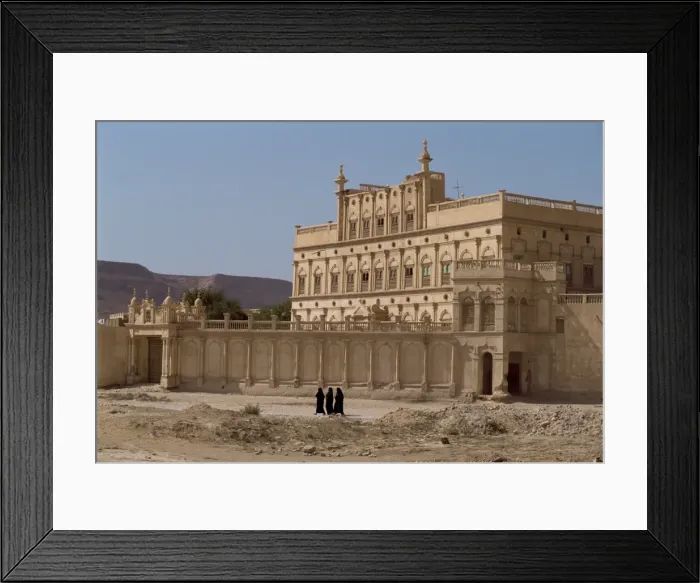 Framed Print : Women in black passing the house of a trader made rich