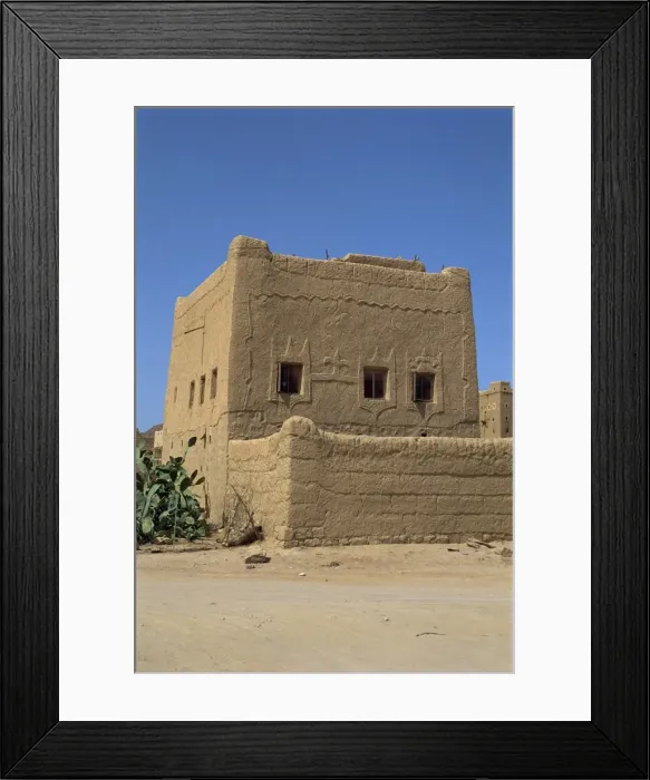 Framed Print : Mud built fortress house with decorated windows Framed Print : Mud built fortress house with decorated windows