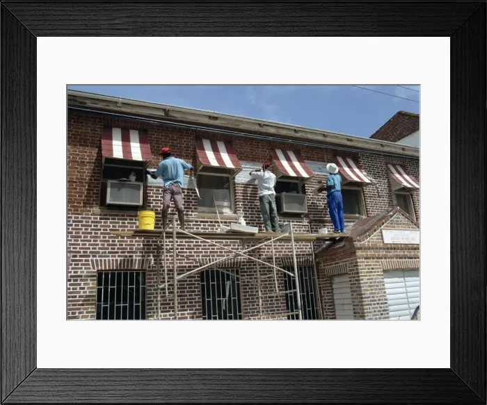 Framed Print : Decorating outside of a house, St Framed Print : Decorating outside of a house, St