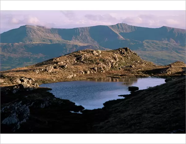 Small lake (llyn) with Cadair Idris (Cader Idris) range behind