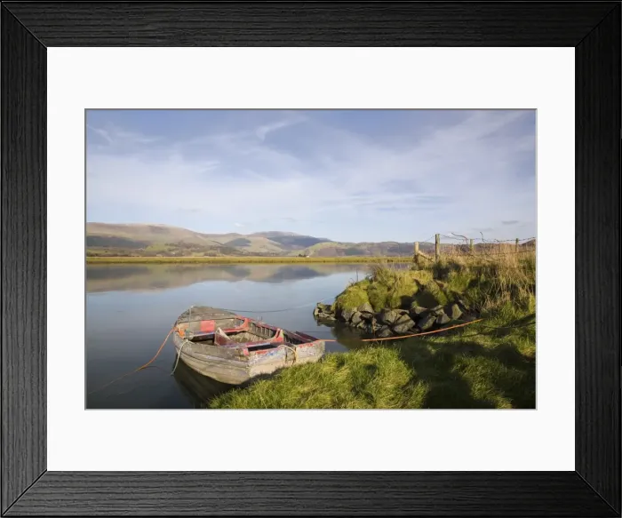 Framed Print : Scenic view with old rowing boat moored on bank in Framed Print : Scenic view with old rowing boat moored on bank in