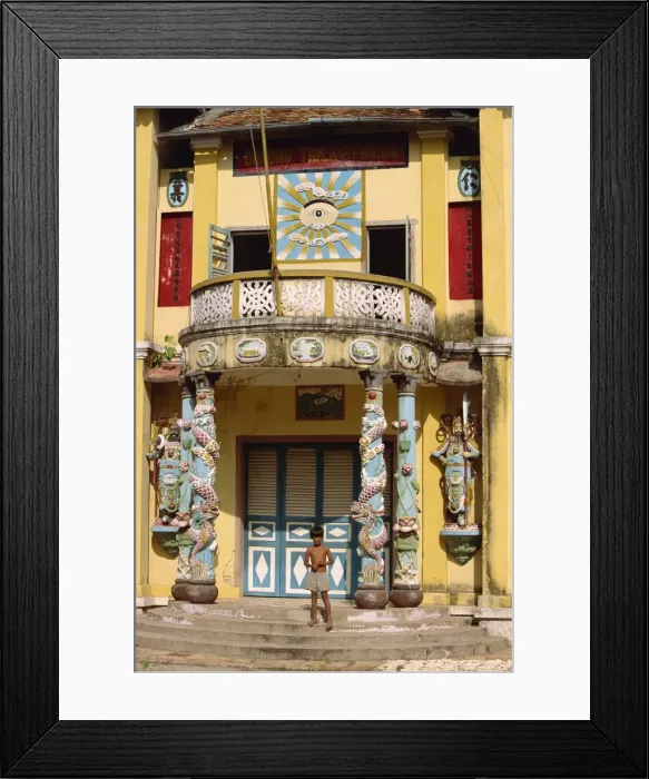 Framed Print : Small boy on steps of the rural Cao Dai temple in Tay Minh Province Framed Print : Small boy on steps of the rural Cao Dai temple in Tay Minh Province
