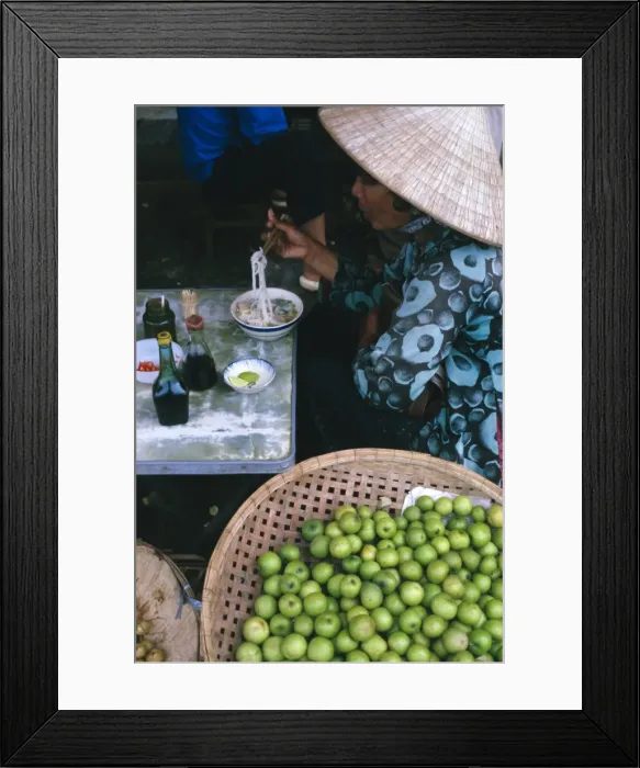 Framed Print : Woman eating pho (noodles) at food stall Framed Print : Woman eating pho (noodles) at food stall