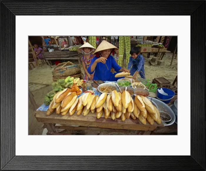 Framed Print : Woman street vendor selling French bread sandwiches Framed Print : Woman street vendor selling French bread sandwiches