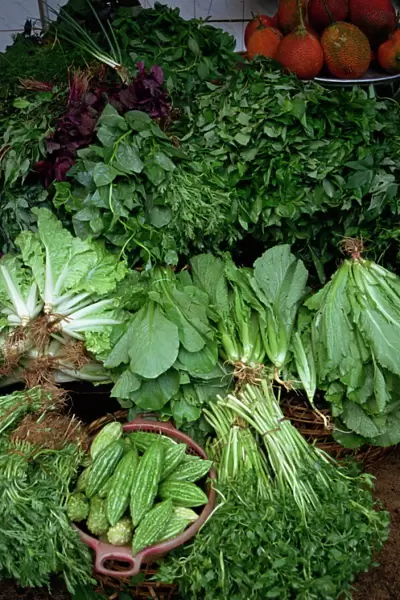 Close-up of greens for sale on a stall in the vegetable