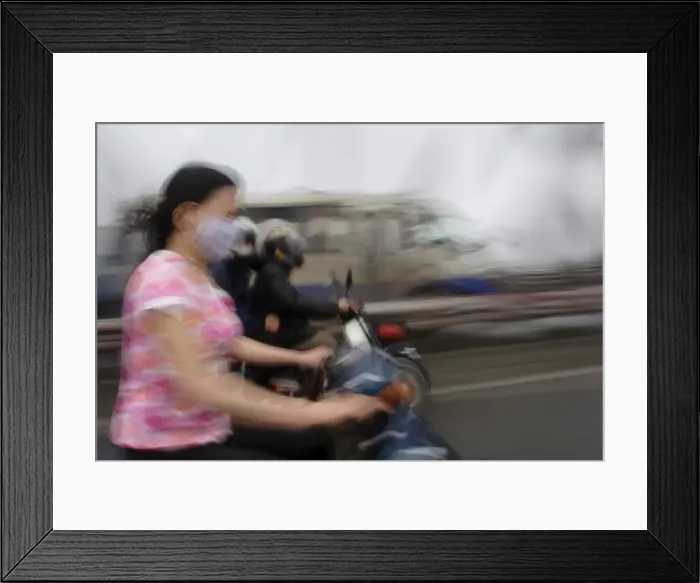 Framed Print : Traffic speeds through Hanoi Framed Print : Traffic speeds through Hanoi