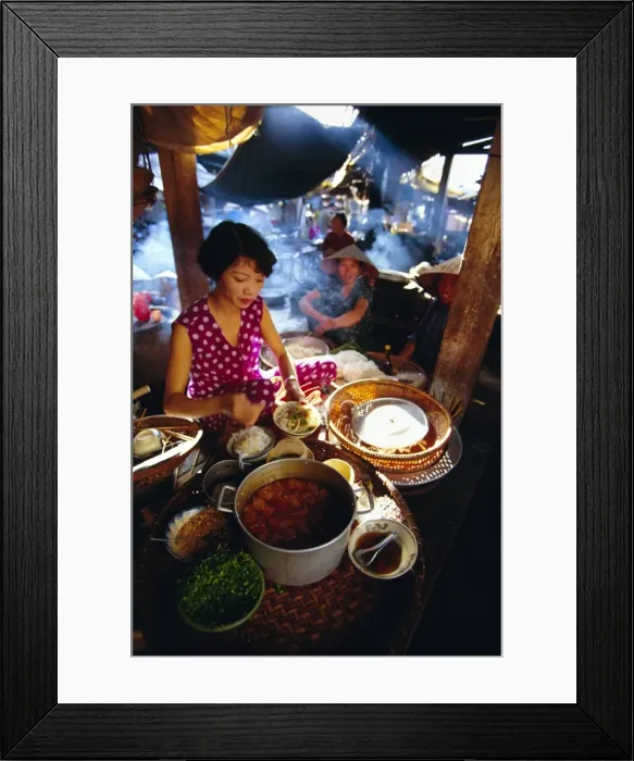 Framed Print : Woman preparing food at a stall in the market Framed Print : Woman preparing food at a stall in the market