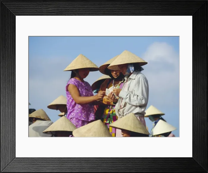 Framed Print : Women in conical hats counting money at the fish market Framed Print : Women in conical hats counting money at the fish market