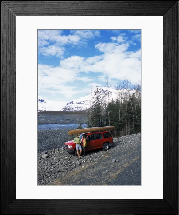 Framed Print : Couple with canoe checking their map at Exit Glacier Framed Print : Couple with canoe checking their map at Exit Glacier