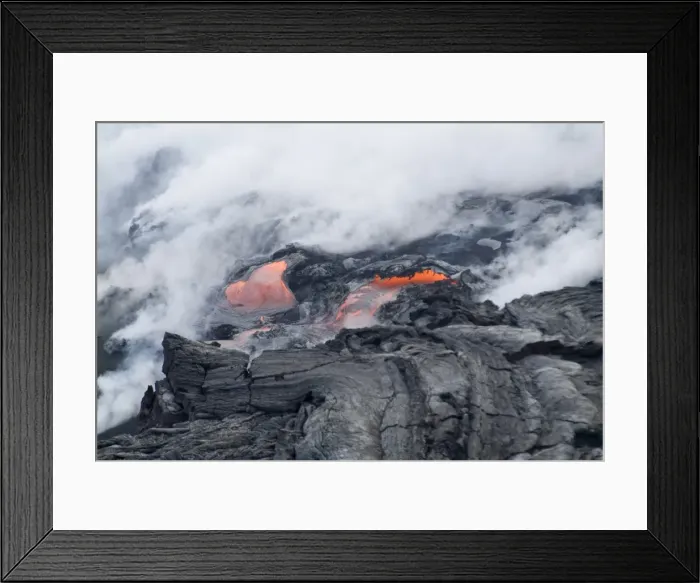 Framed Print : Steam plumes from hot lava flowing onto beach and into the ocean Framed Print : Steam plumes from hot lava flowing onto beach and into the ocean