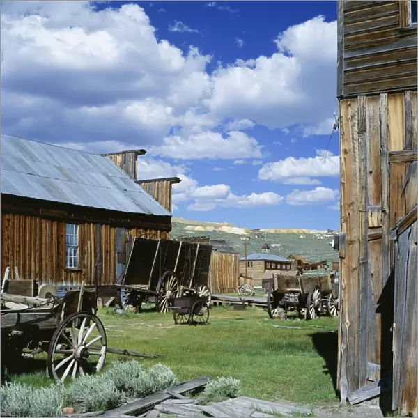 Wooden buildings and carts at Bodie