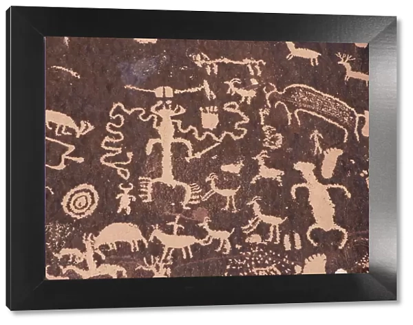 Indian petroglyphs drawn on red standstone by scratching